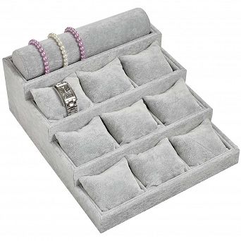 Ekspozytor schodkowy z 9 poduszkami i wałkiem szary